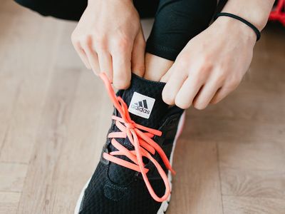 Close-up of comfortable sports shoes on a yoga mat.